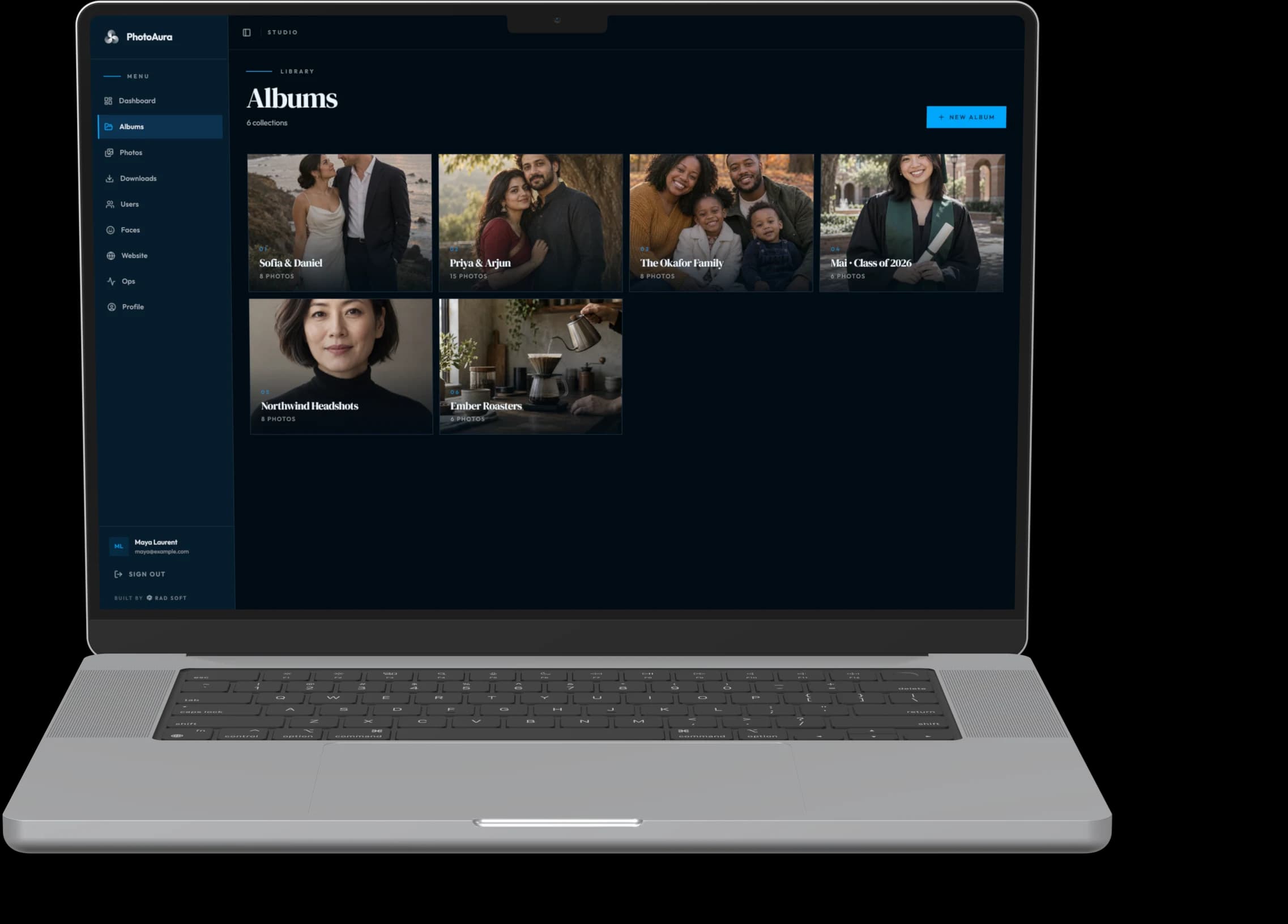 PhotoAura studio — albums on a MacBook