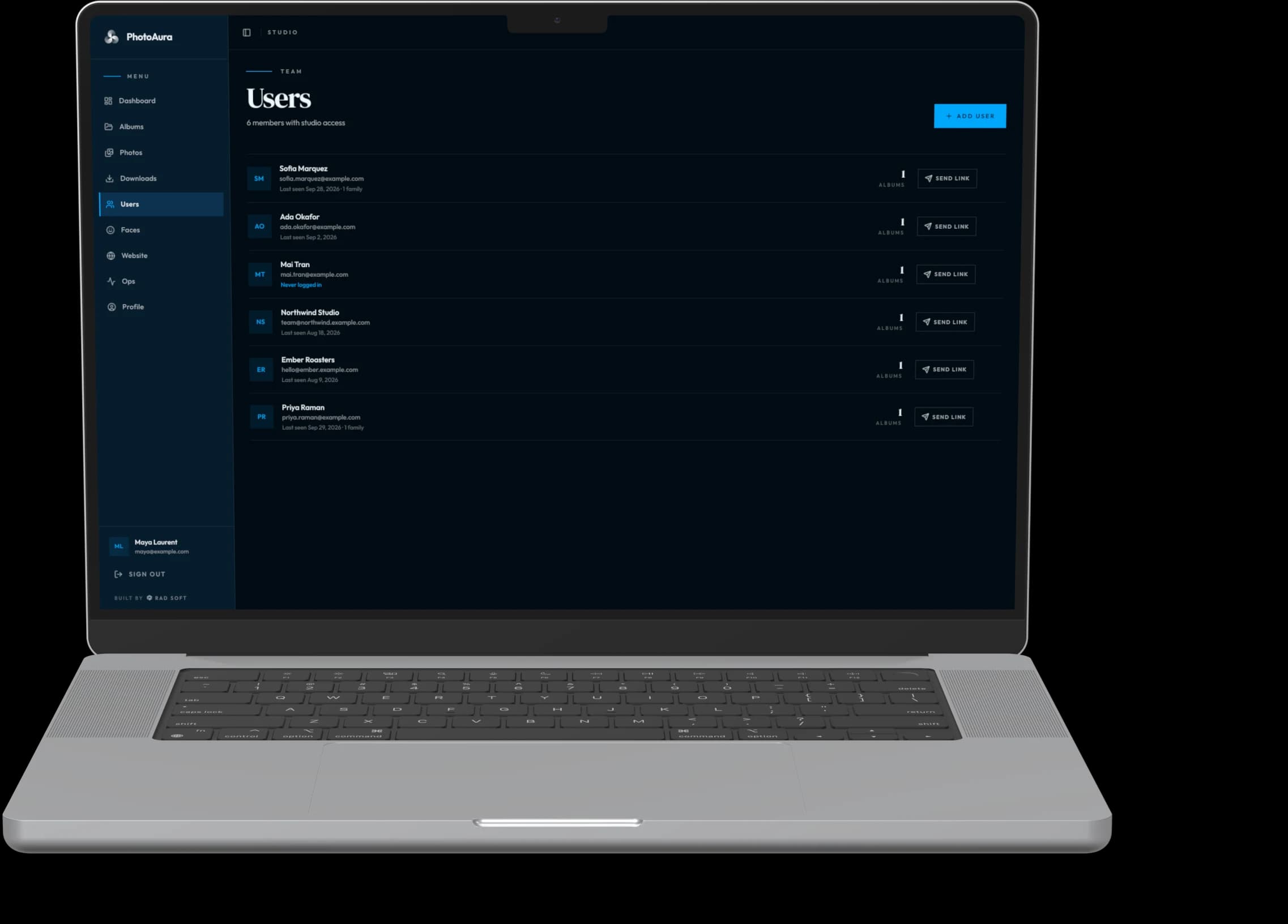 PhotoAura studio — clients on a MacBook